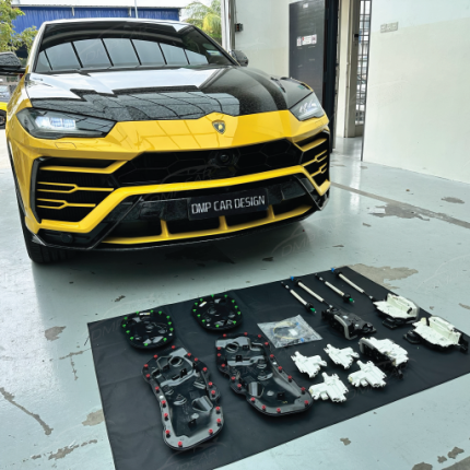 Lamborghini Urus OEM Soft Close Door Kit by DMP – Complete suction door system displayed with motors, modules, and wiring harnesses